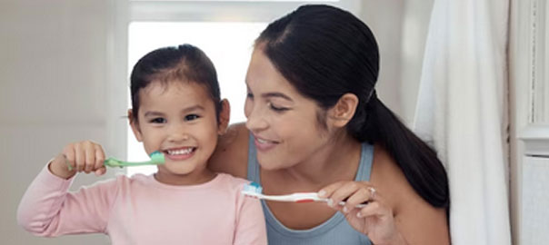 Kids Dentistry | Mother and Daughter Brushing Teeth