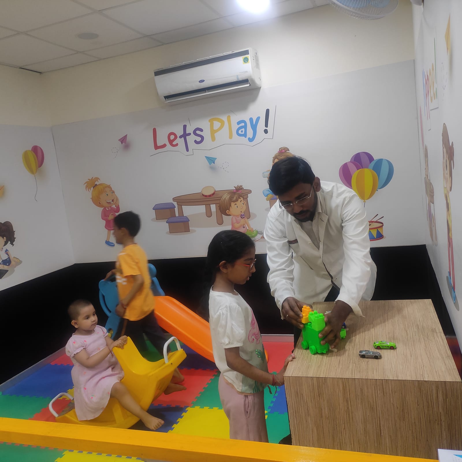 Kids Playing with Dentists at Clove Dental Clinic